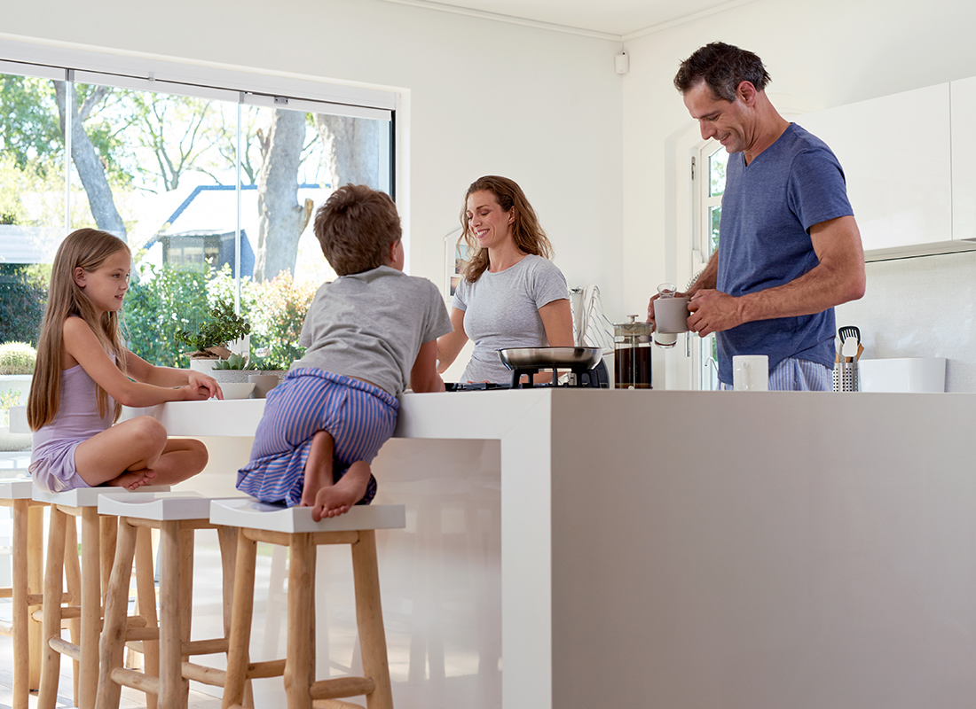 Personal Insurance - Happy Family Sitting Together for Breakfast